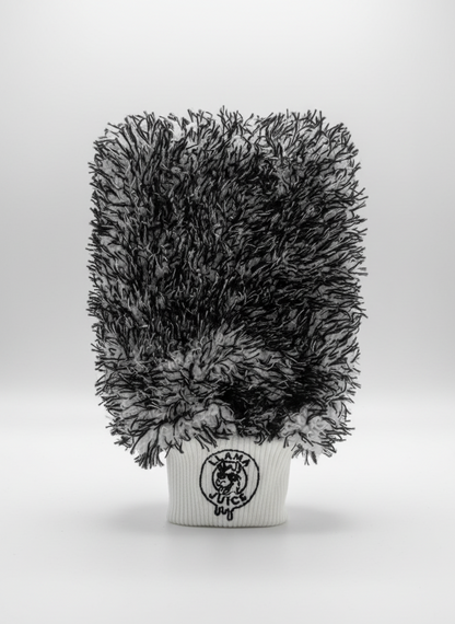 Black and gray textured plant in a white pot with a logo on a light gray background