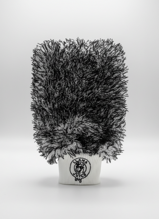 Black and gray textured plant in a white pot with a logo on a light gray background